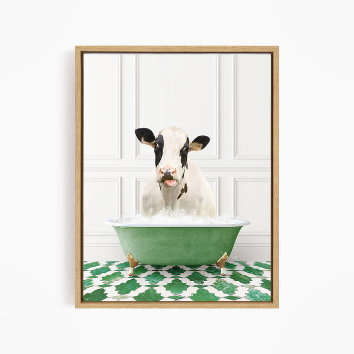 A black and white cow is sitting in a green bathtub filled with water, creating a whimsical and humorous scene.