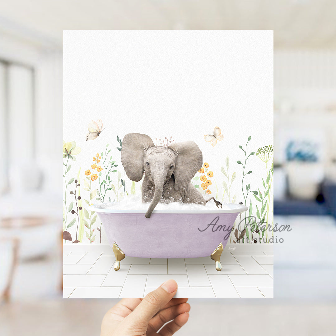 a person holding up a card with an elephant in a bathtub