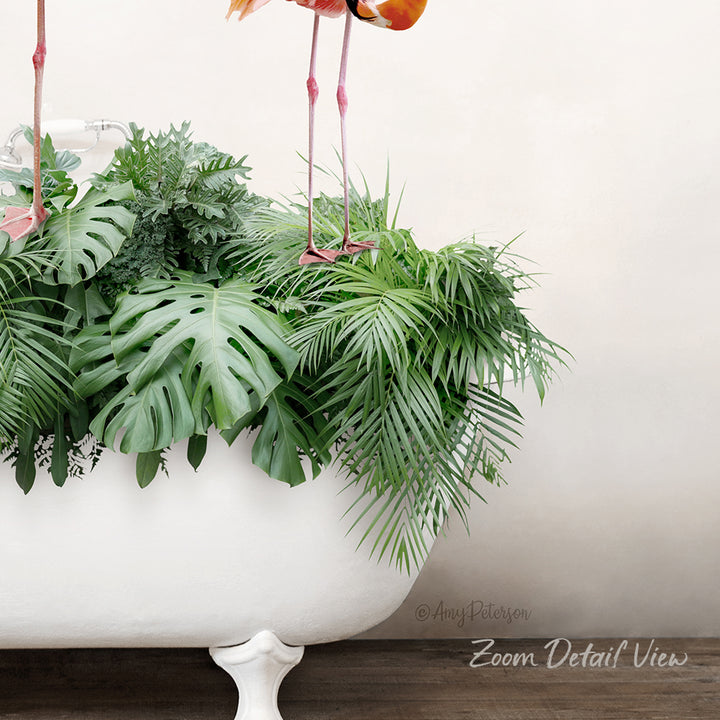 A white bathtub filled with lush green plants and ferns, with two pink flamingos standing on the rim of the tub.