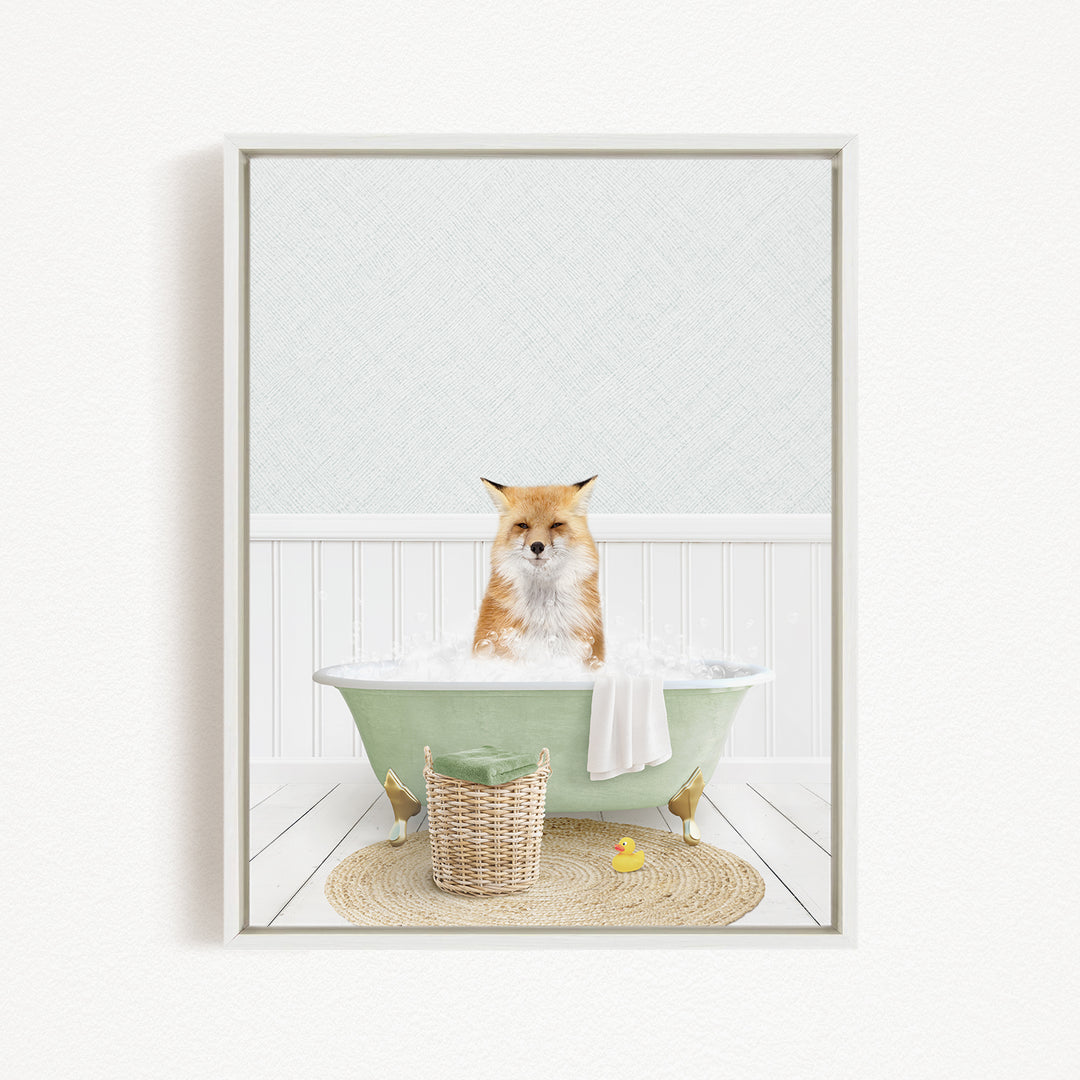 A fox is sitting in a green bathtub filled with bubbles, surrounded by a yellow rubber duck and a white towel.