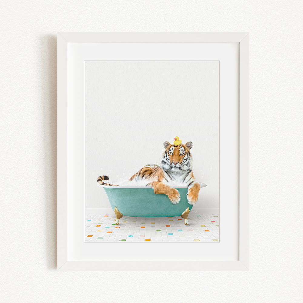 A tiger is sitting in a green bathtub filled with water, surrounded by colorful tiles on the floor.