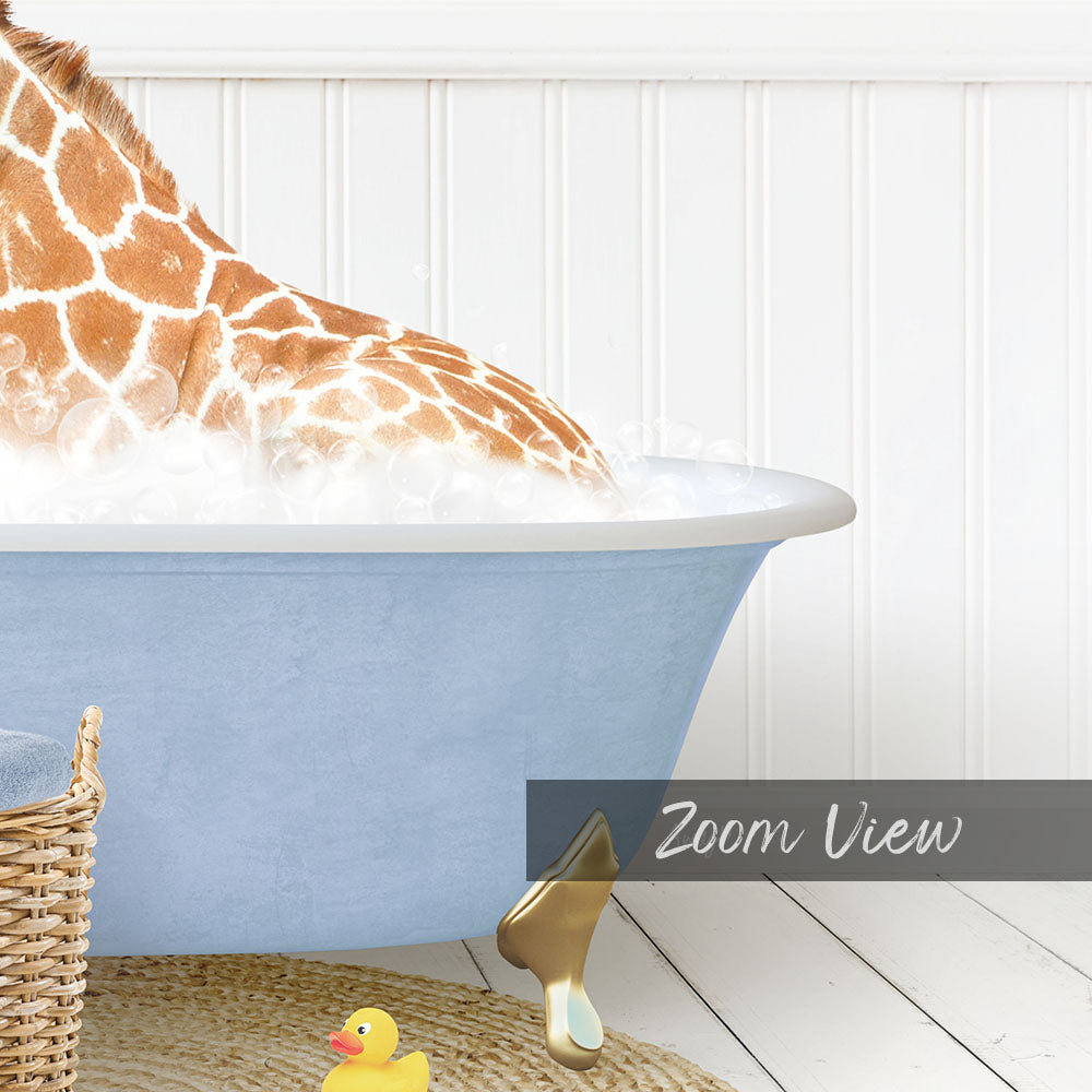 A giraffe is sitting in a blue bathtub filled with water, surrounded by a yellow rubber duck and a basket.