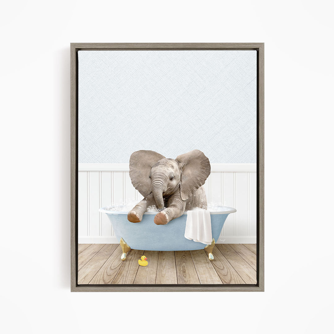 A baby elephant sitting in a blue bathtub, surrounded by rubber ducks.