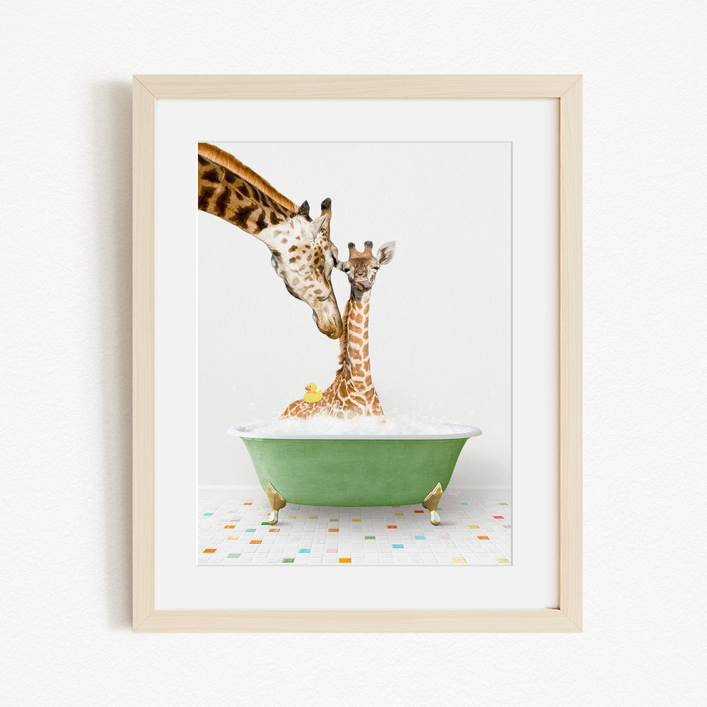 A mother giraffe and her baby giraffe are enjoying a bath together in a green bathtub, with the mother gently nuzzling her baby.