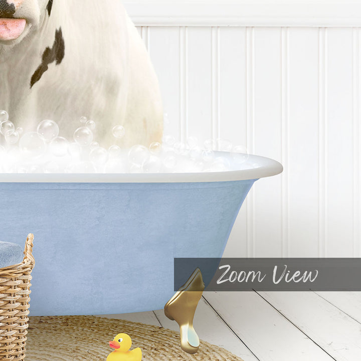 A white cow is standing in a blue bathtub filled with bubbles, with a yellow rubber duck nearby.