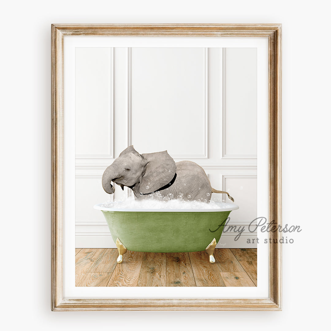 a picture of an elephant taking a bath in a green tub