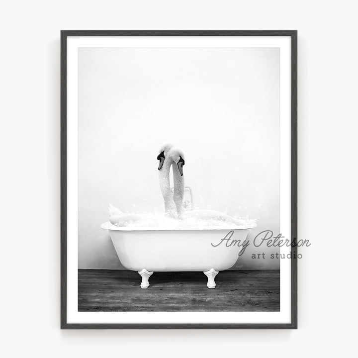 a black and white photo of a person in a bathtub