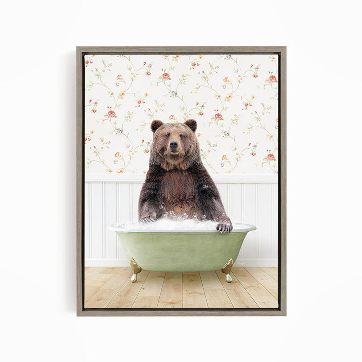 A brown bear sitting in a green bathtub filled with water, surrounded by a floral wallpaper.
