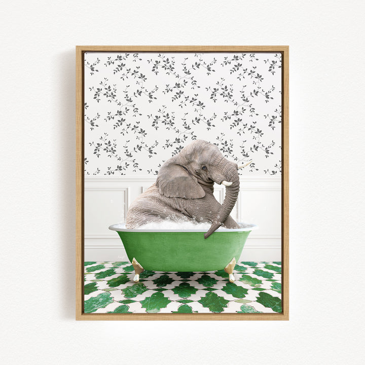 A gray elephant is sitting in a green bathtub, surrounded by a patterned wall and green and white tiles on the floor.