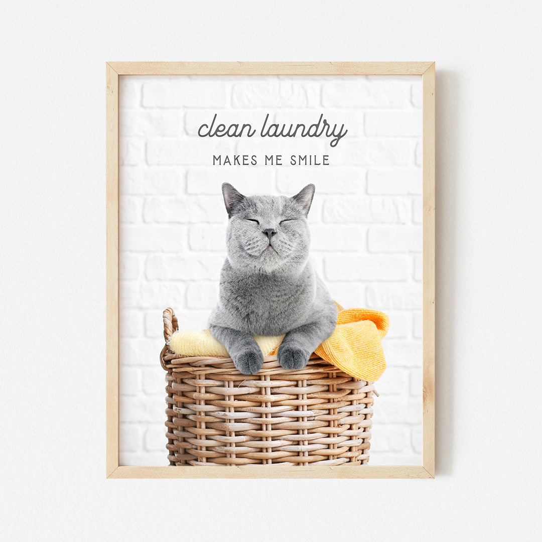 a gray cat sitting in a basket with a yellow towel