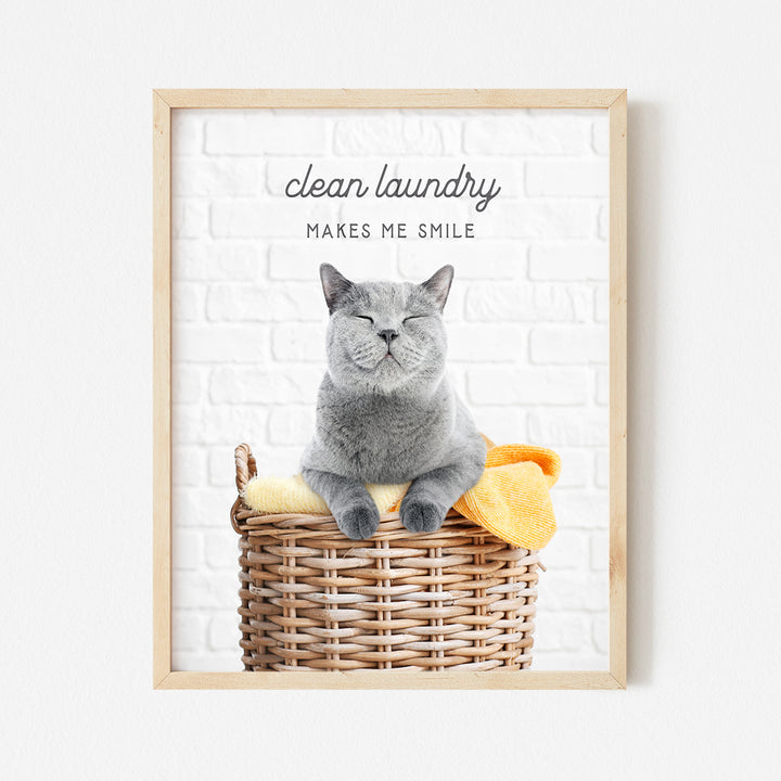 a gray cat sitting in a basket with a yellow towel