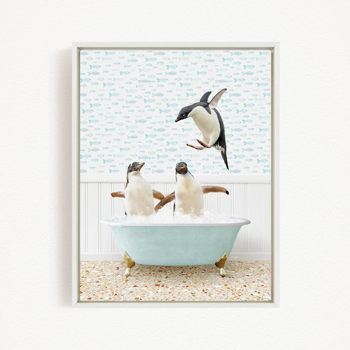 A framed image depicting two penguins sitting in a bathtub, with one penguin flying towards the other penguin.