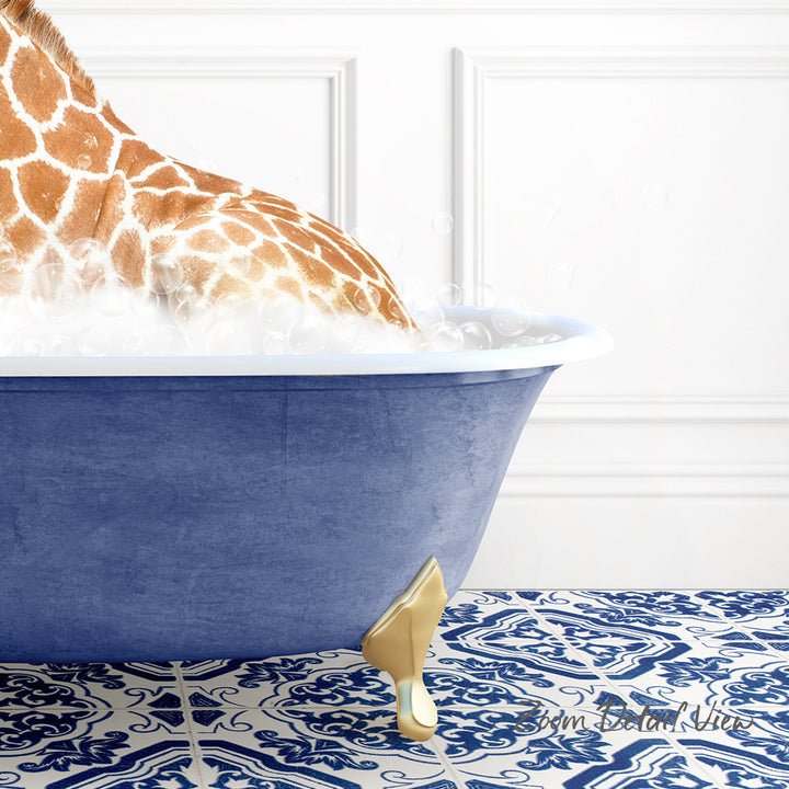 A giraffe is sitting in a blue bathtub filled with water, with bubbles around it, against a white wall with a patterned tile floor.