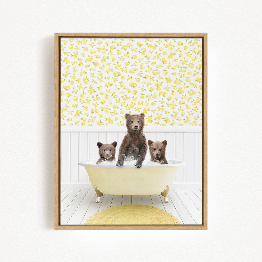 A framed image depicting three bears sitting in a bathtub, with a yellow floral pattern on the wall behind them.