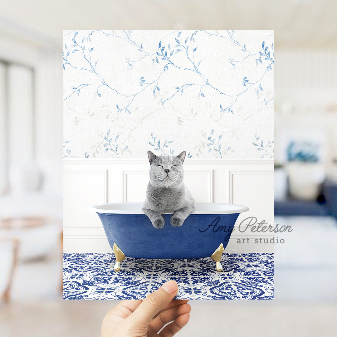 a person holding a card with a cat in a bathtub