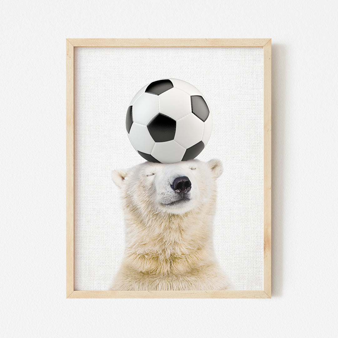 a polar bear balancing a soccer ball on its head