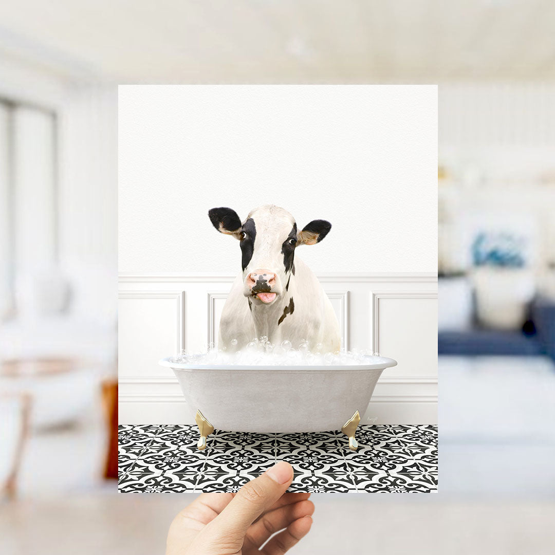 A cow is sitting in a bathtub filled with water, creating a humorous and unexpected scene.