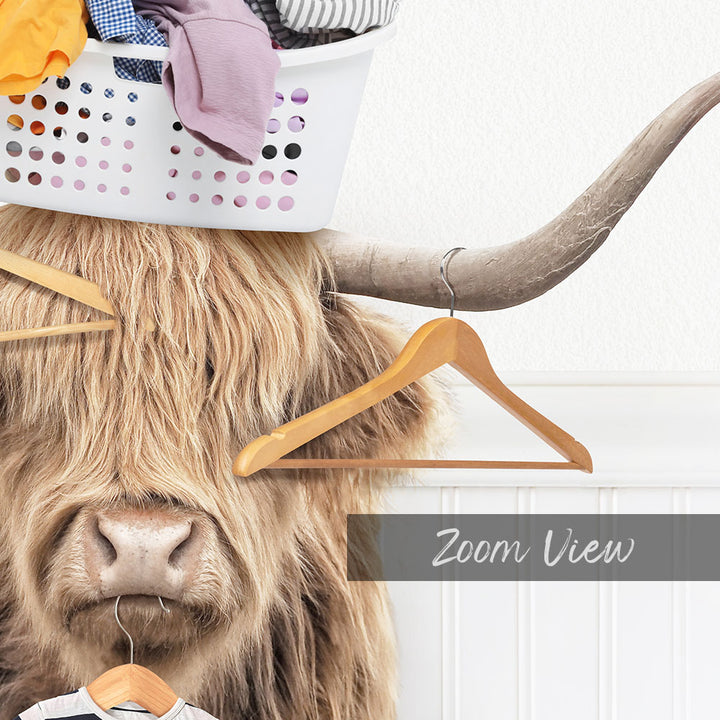 A long-haired, horned animal with a basket of clothes on its head, and a wooden hanger hanging from its horns.