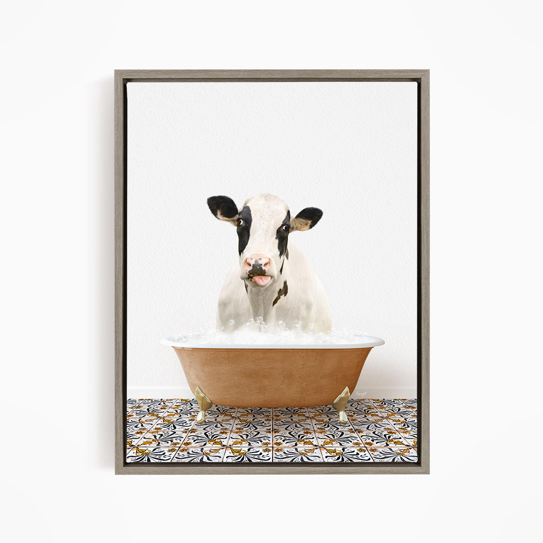 A black and white cow is sitting in a brown bathtub filled with water, creating a whimsical and humorous scene.