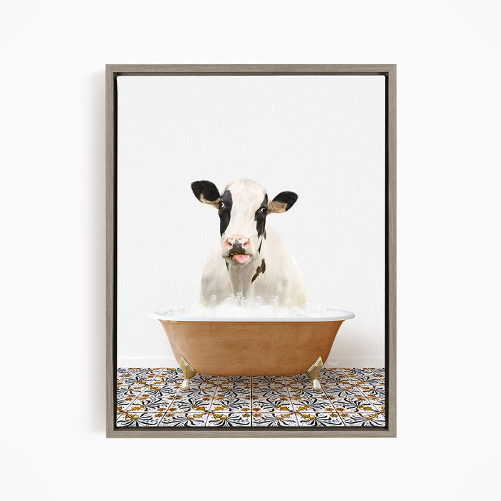 A black and white cow is sitting in a brown bathtub filled with water, creating a whimsical and humorous scene.