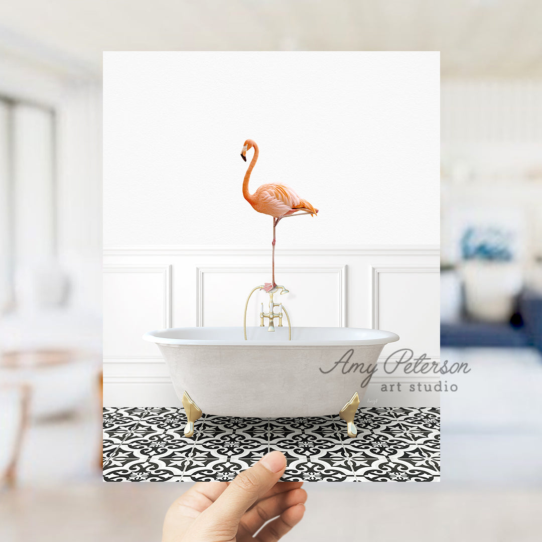 a person holding a card with a flamingo in a bathtub