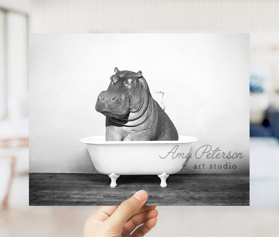 a hippo sitting in a bathtub with the caption art studio