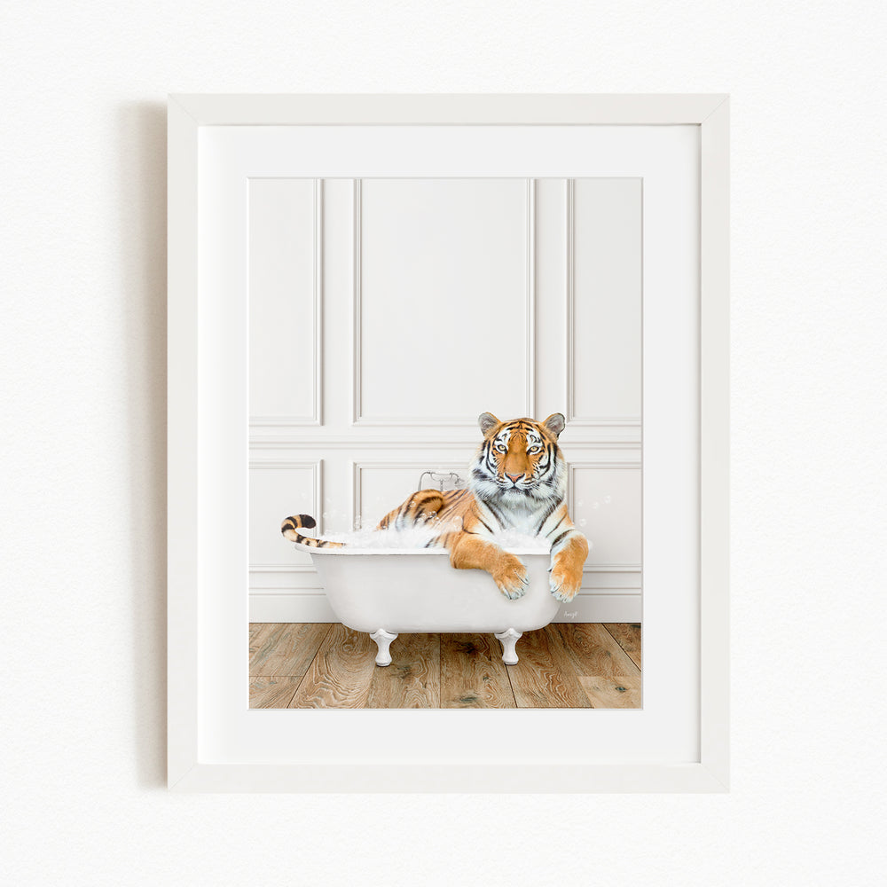 A tiger is sitting in a white bathtub, appearing relaxed and enjoying the bath.