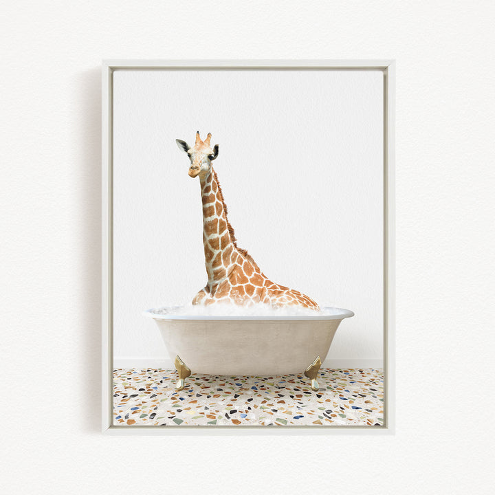 A giraffe sitting in a white bathtub filled with bubbles, creating a whimsical and playful scene.