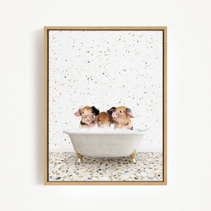 Three adorable pigs sitting in a white bathtub, enjoying a relaxing bath.