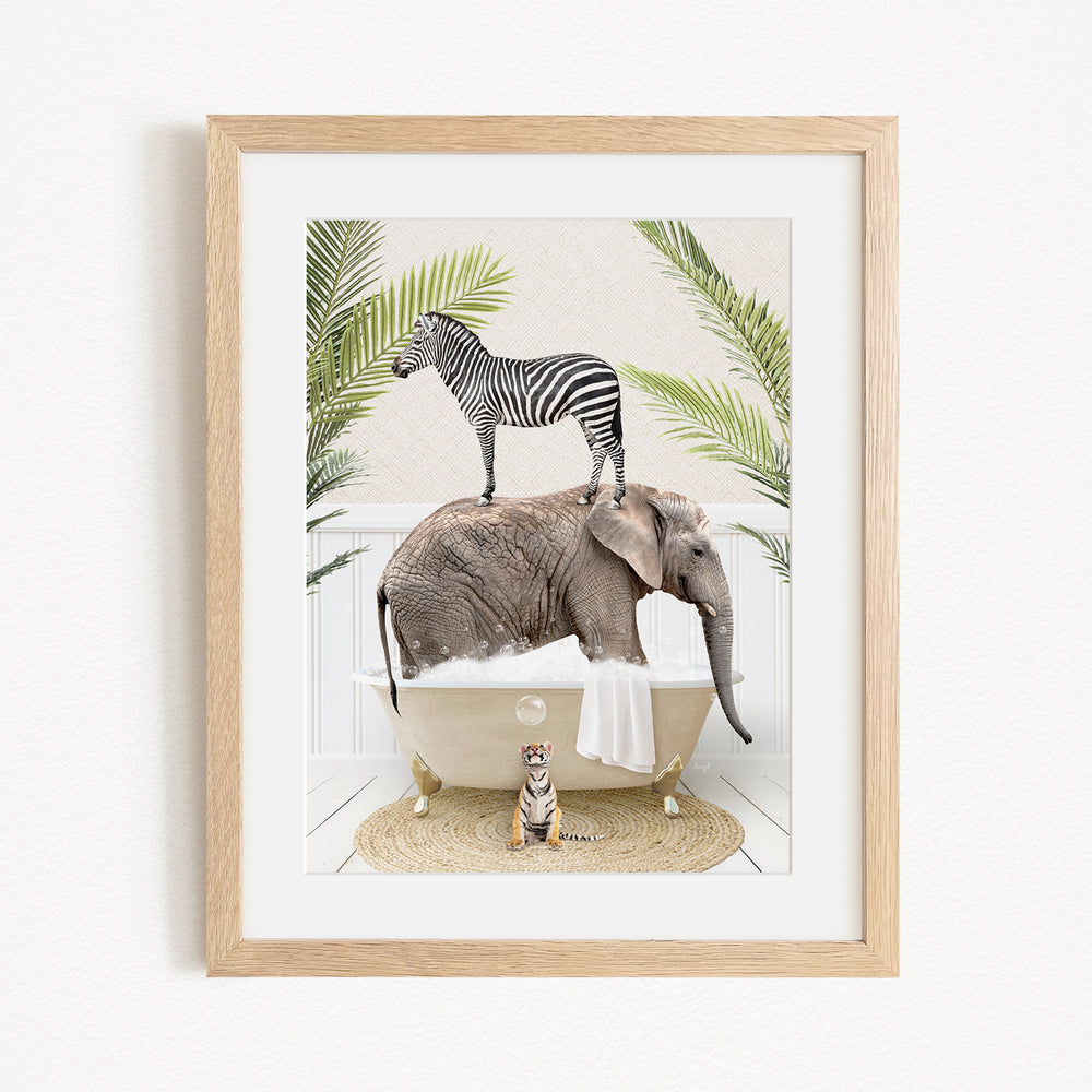 A framed image depicting a zebra standing on an elephant's back while the elephant is submerged in a bathtub, with a tiger sitting on the edge of the tub.