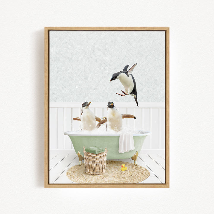 A framed image depicting two penguins sitting in a green bathtub, with one penguin flying towards the other.