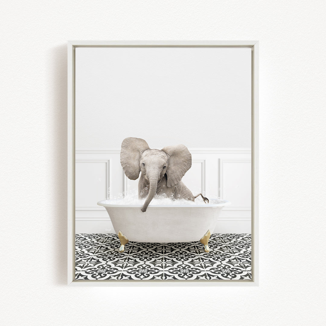 A baby elephant sitting in a white bathtub filled with water, surrounded by a black and white patterned floor.