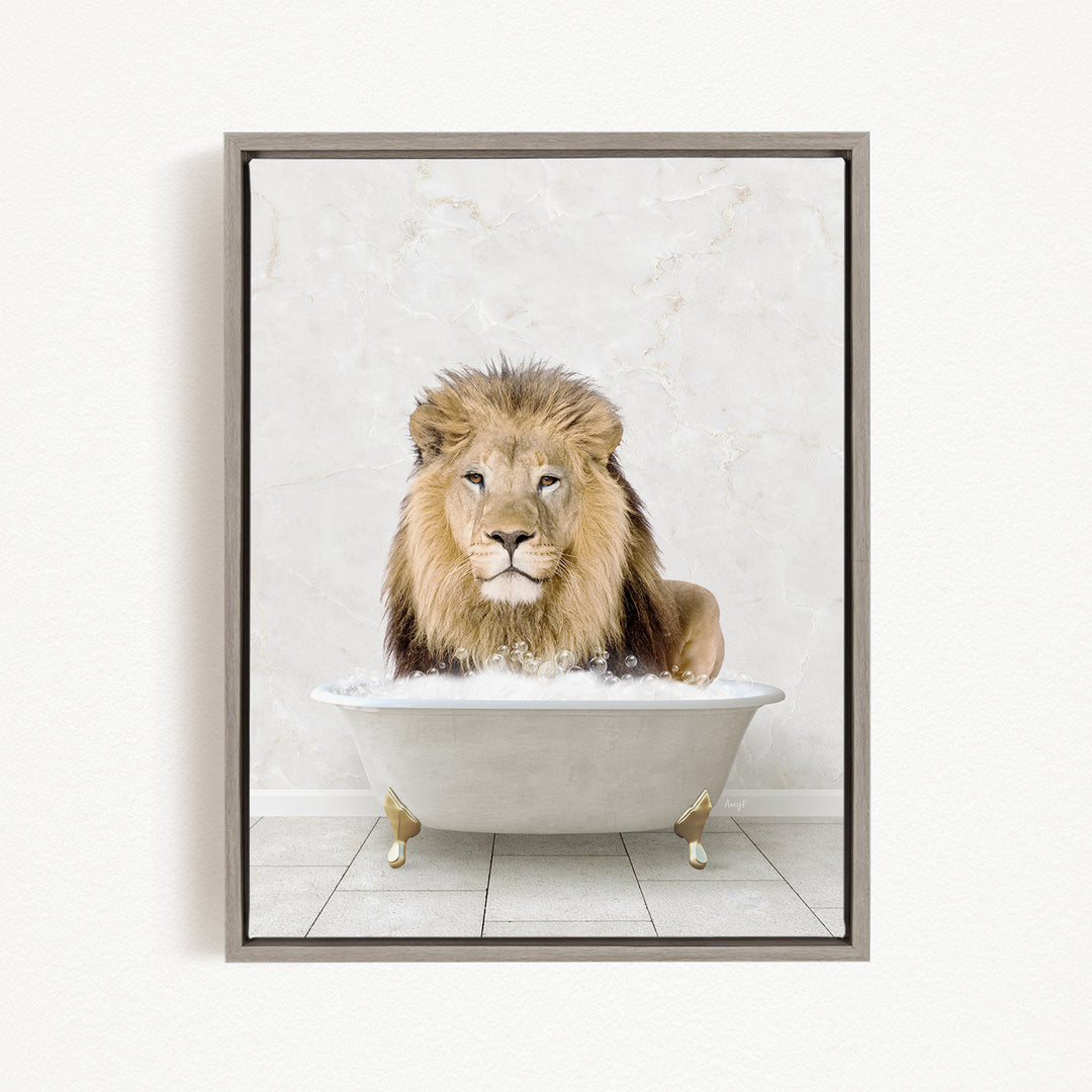 A lion sitting in a white bathtub filled with bubbles, looking directly at the camera.