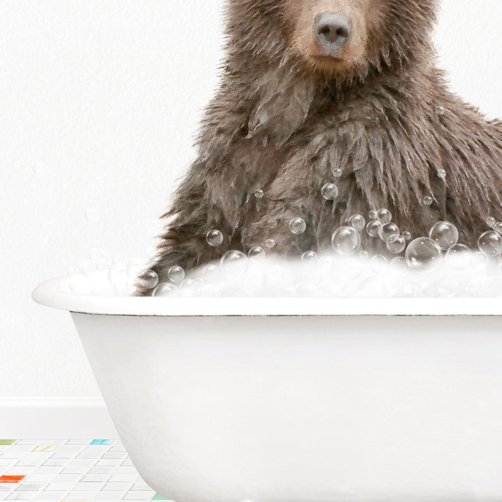 a brown bear sitting in a bathtub filled with bubbles