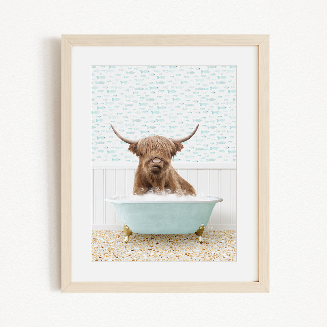 A brown cow with long horns is sitting in a light blue bathtub, surrounded by a patterned wall and a beige floor.