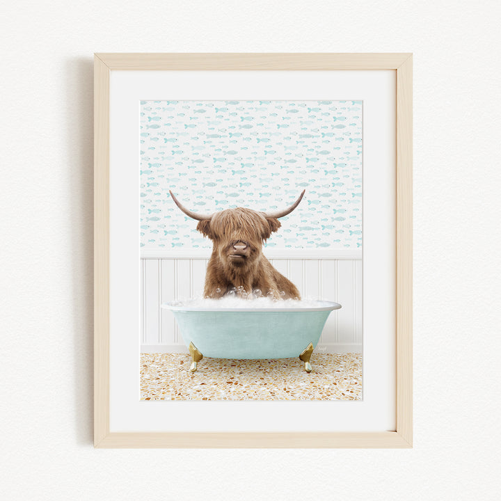 A brown cow with long horns is sitting in a light blue bathtub, surrounded by a patterned wall and a beige floor.