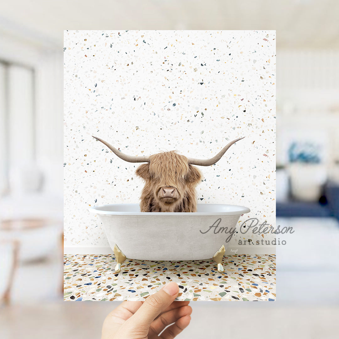 a hand holding up a card with a picture of a bull in a bathtub