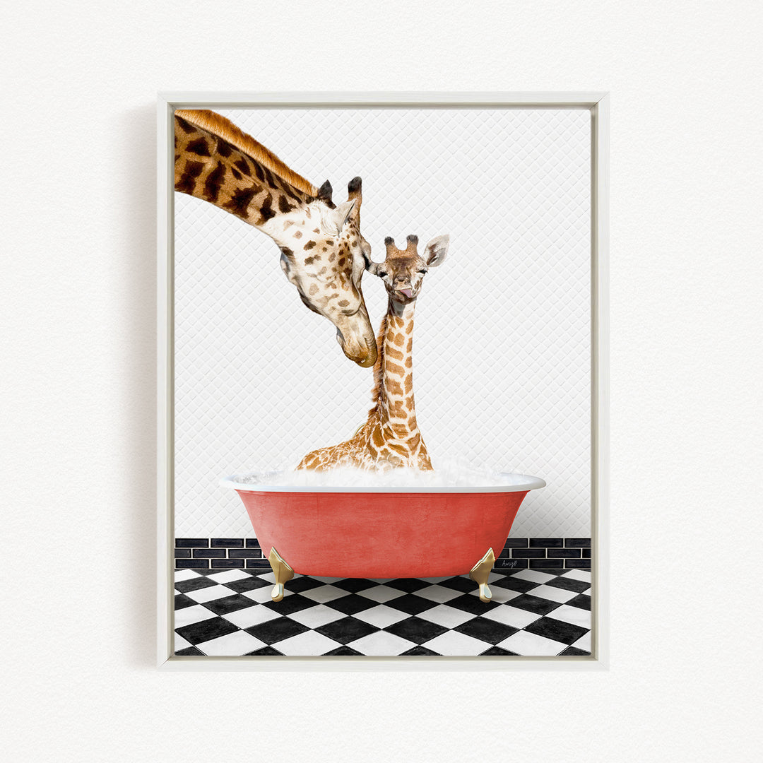 A mother giraffe and her baby giraffe are sitting together in a red bathtub, with the mother gently licking her baby.
