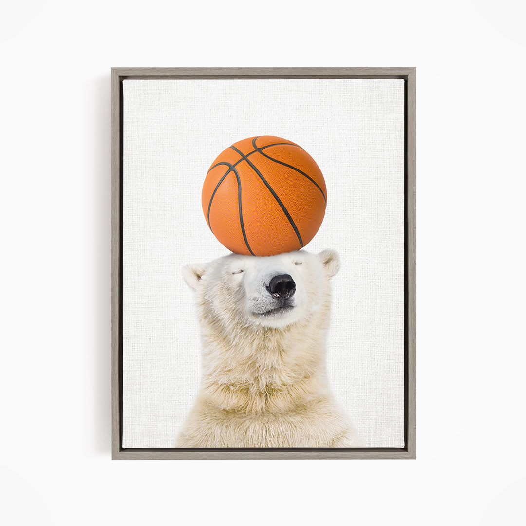 A polar bear balancing a basketball on its head.