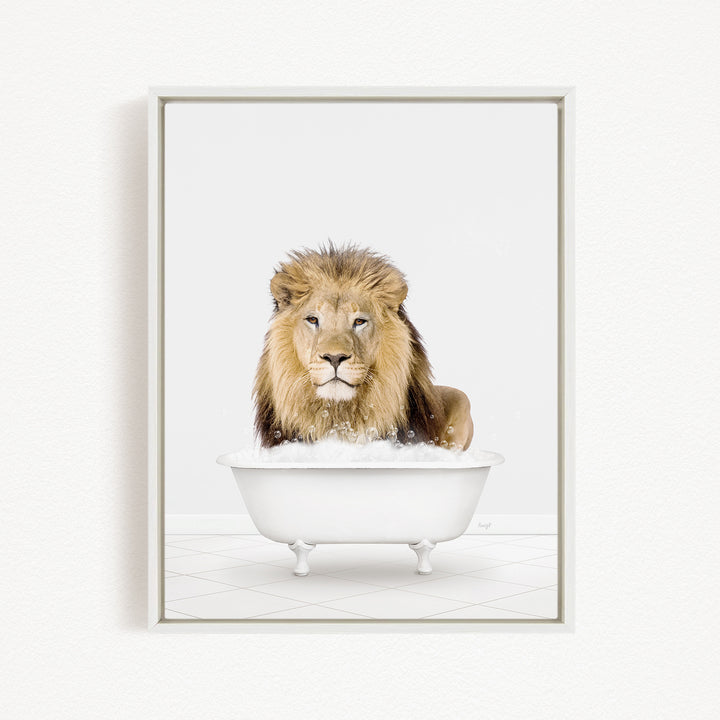 A lion sitting in a white bathtub filled with bubbles.