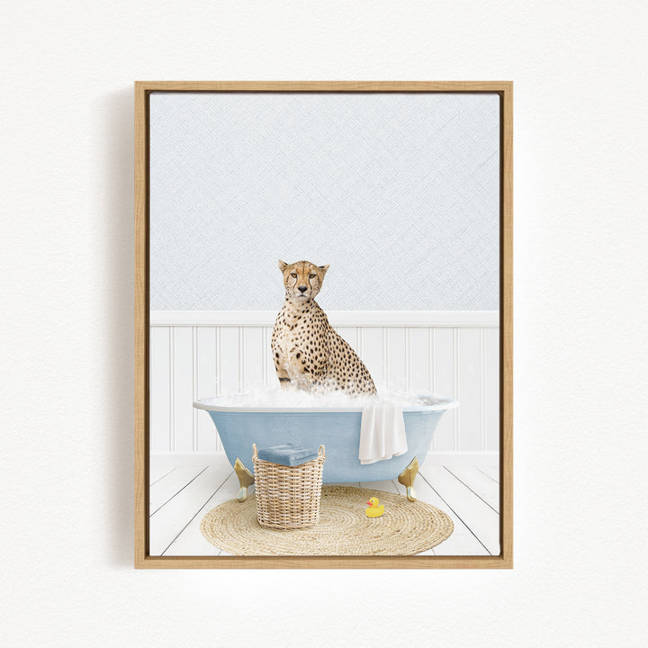 A cheetah sitting in a blue bathtub filled with water, surrounded by a yellow rubber duck and a woven basket.