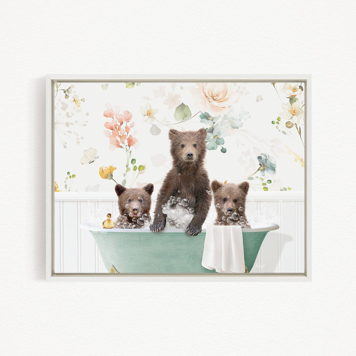 Three adorable brown bears sitting in a green bathtub, surrounded by a floral pattern.