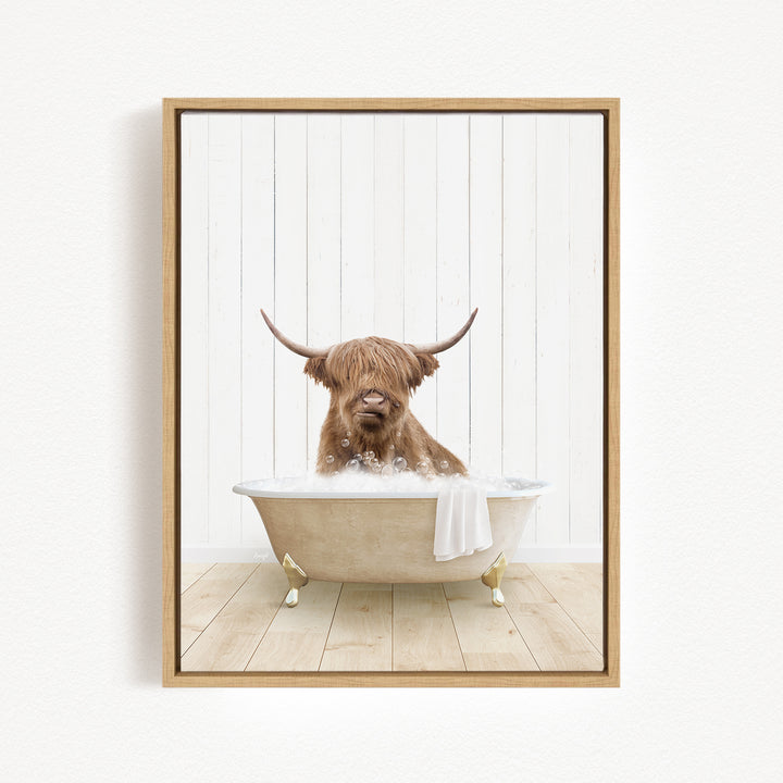 A brown cow with long horns is sitting in a bathtub filled with water, creating a whimsical and humorous scene.