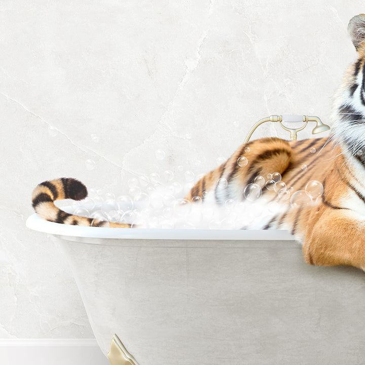 a stuffed tiger sitting in a bath tub