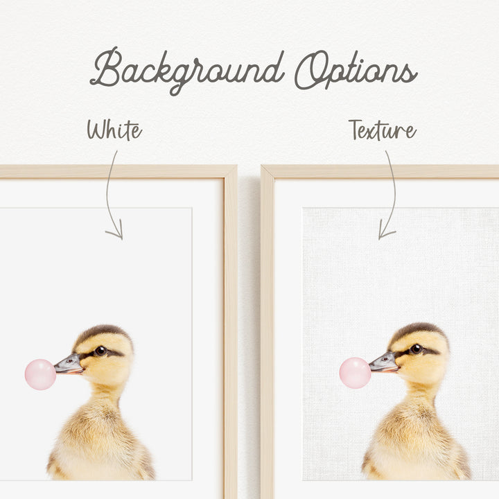 a cute duckling blowing a bubble with a bubble gum bubble.