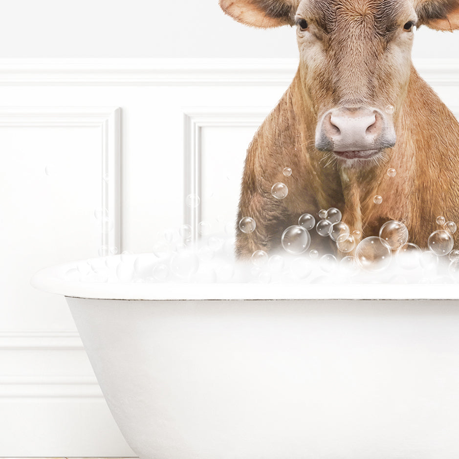 a brown cow sitting in a bathtub filled with bubbles