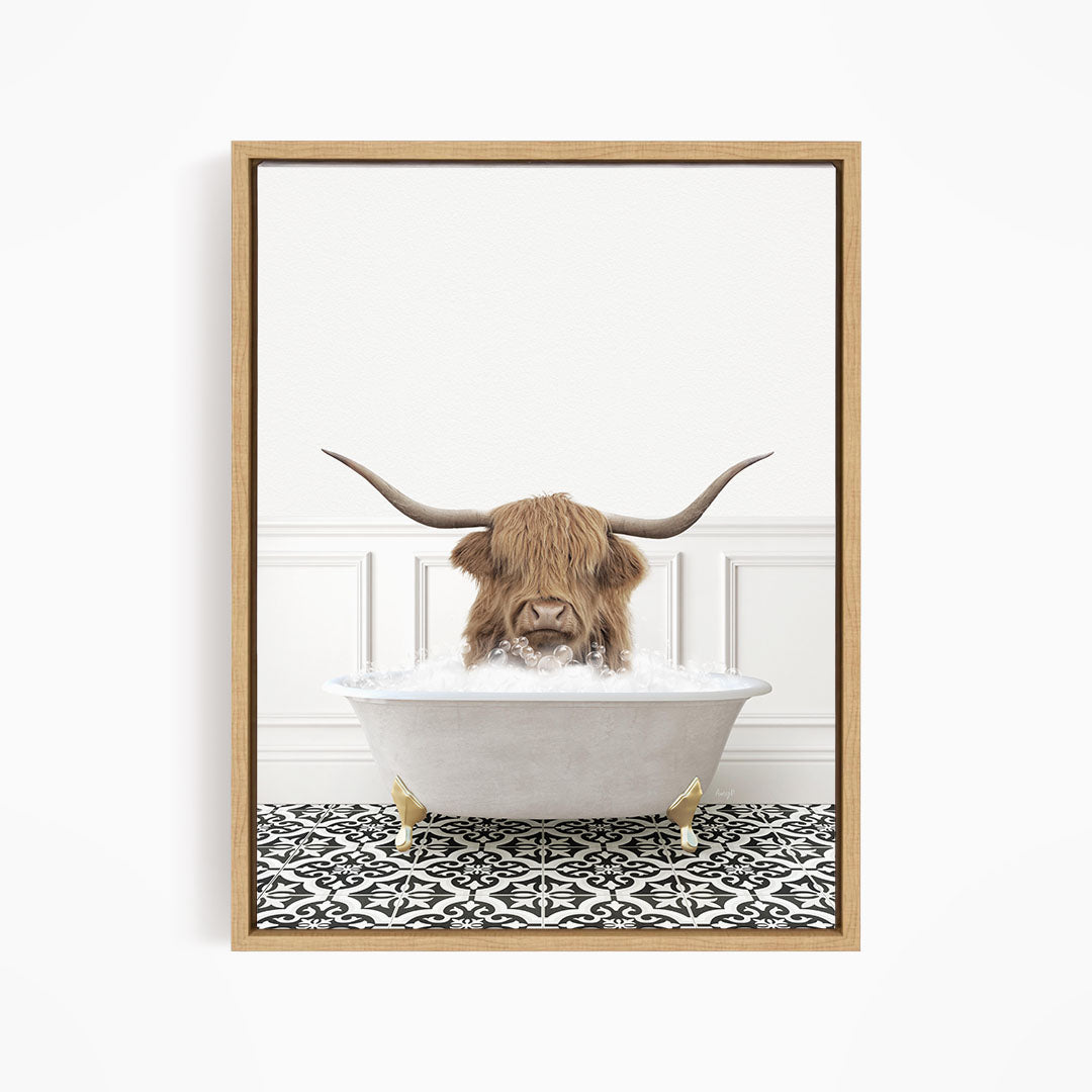 A brown cow with long horns is sitting in a white bathtub filled with water, creating a whimsical and humorous scene.