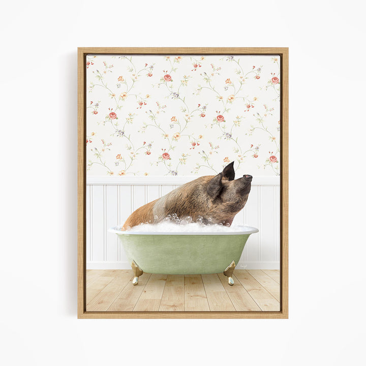 A brown pig sitting in a green bathtub filled with water, with a floral wallpaper in the background.