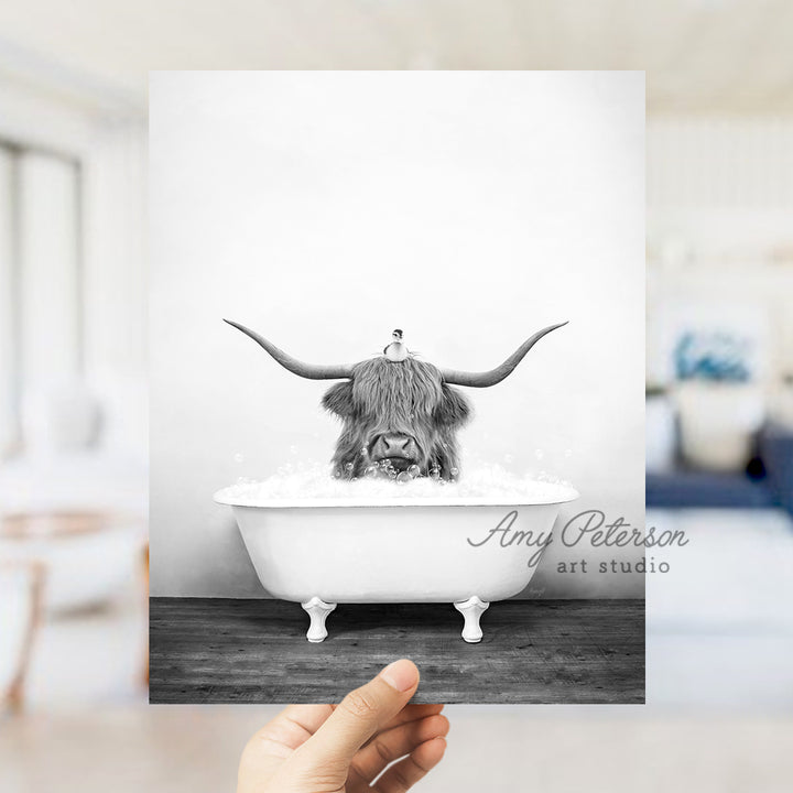 a black and white photo of a bull in a bathtub