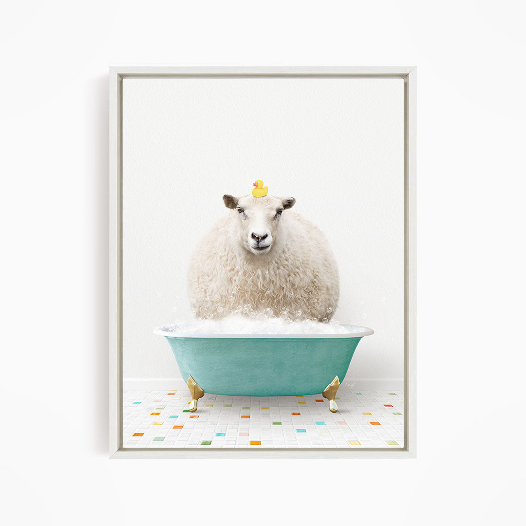 A fluffy white sheep sits in a blue bathtub, with a yellow rubber duck perched on its head.